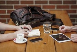 meeting at a table between two business partners