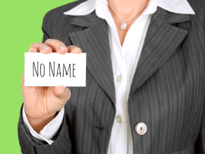 woman holding a card that says no name