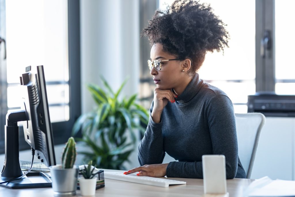 Woman on laptop choosing color scheme for your website